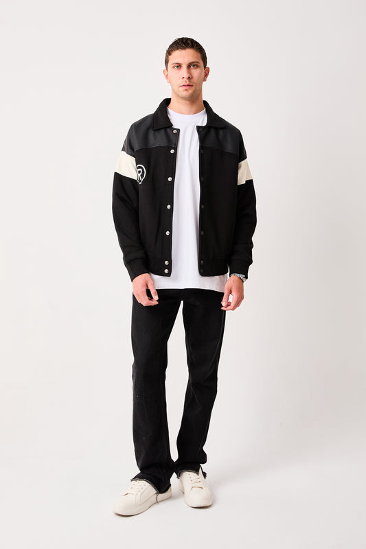 X-2005 Mens Varsity Bomber Jacket Black Snap Button Faux Leather Shoulder Panel Color Block Sleeve Ribbed Hem Fleece Lined