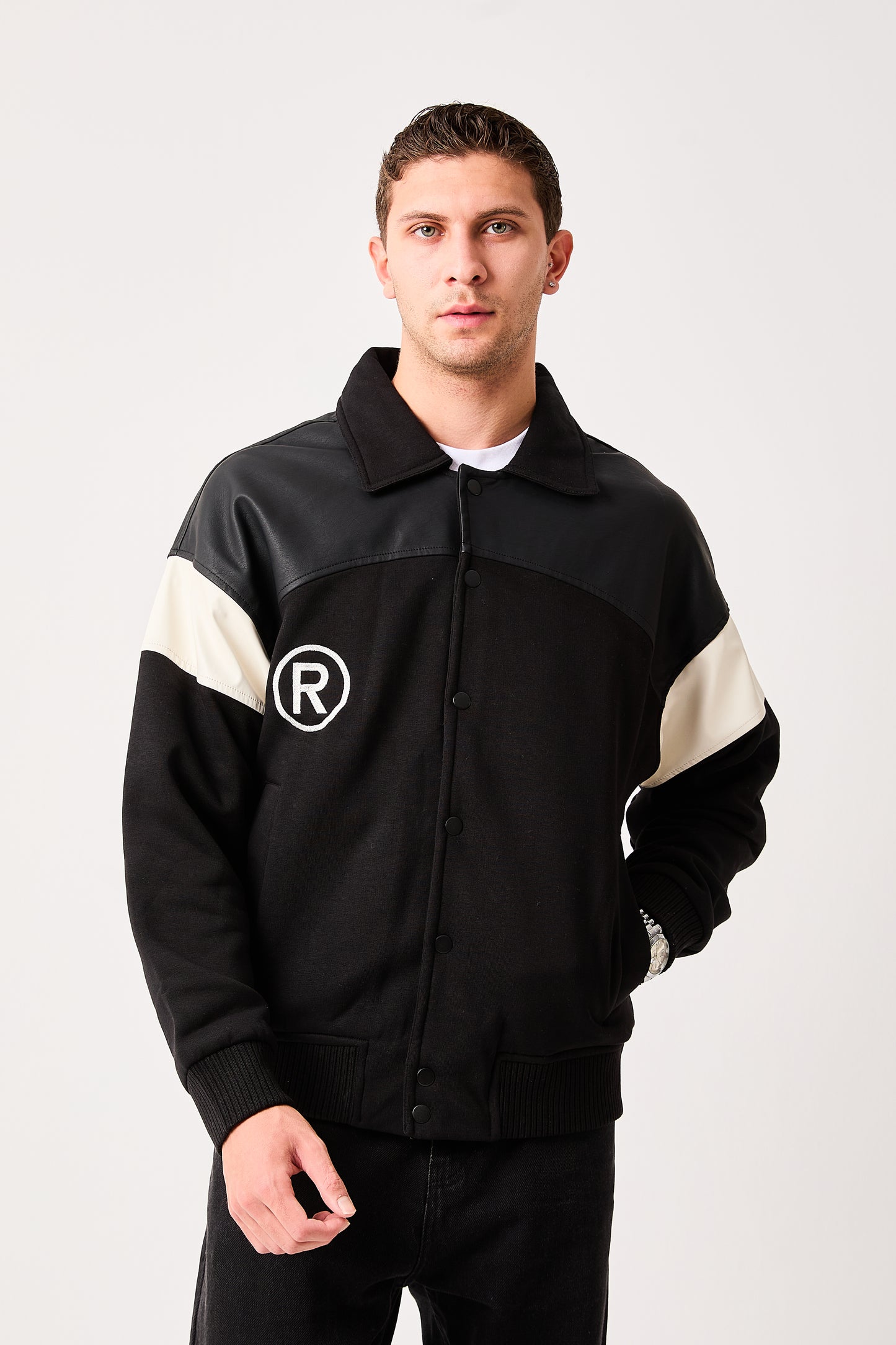 X-2005 Mens Varsity Bomber Jacket Black Snap Button Faux Leather Shoulder Panel Color Block Sleeve Ribbed Hem Fleece Lined
